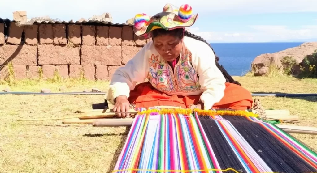 A local woman weaving textile in Lake Titicaca