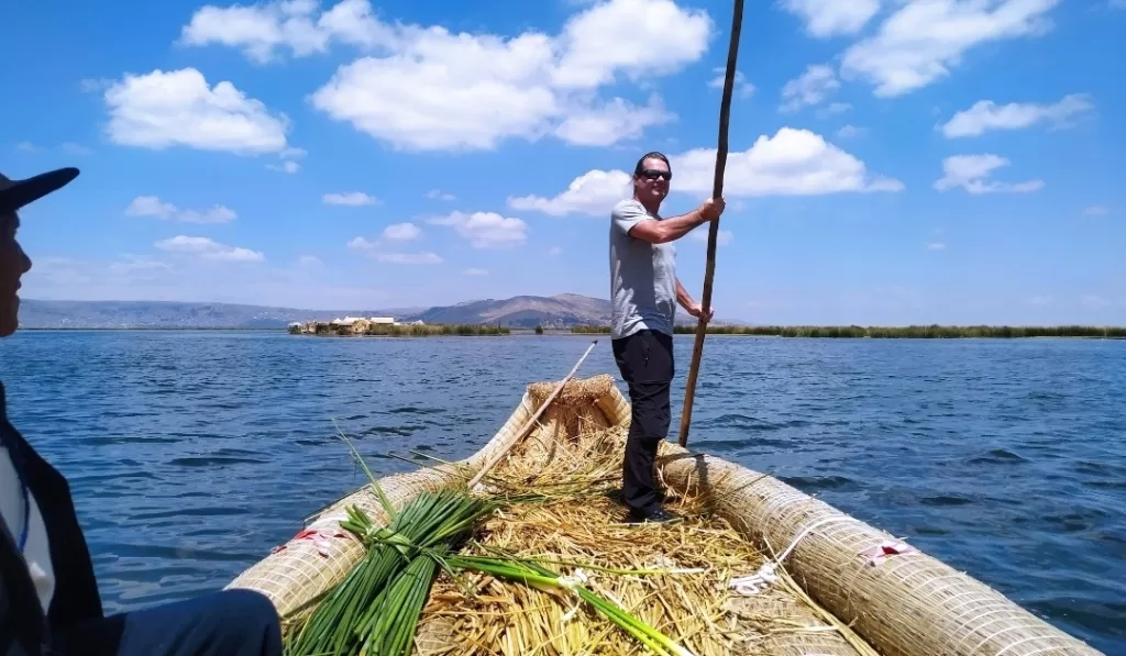 A man rowing the reed raft at Uros Islands