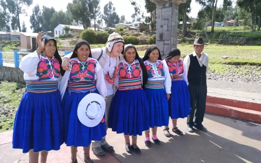 Posing with the local Amantani women