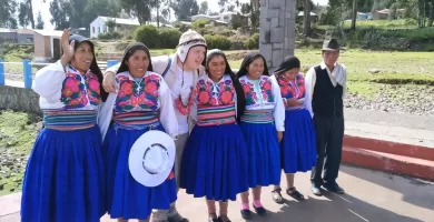 Posing with the local Amantani women