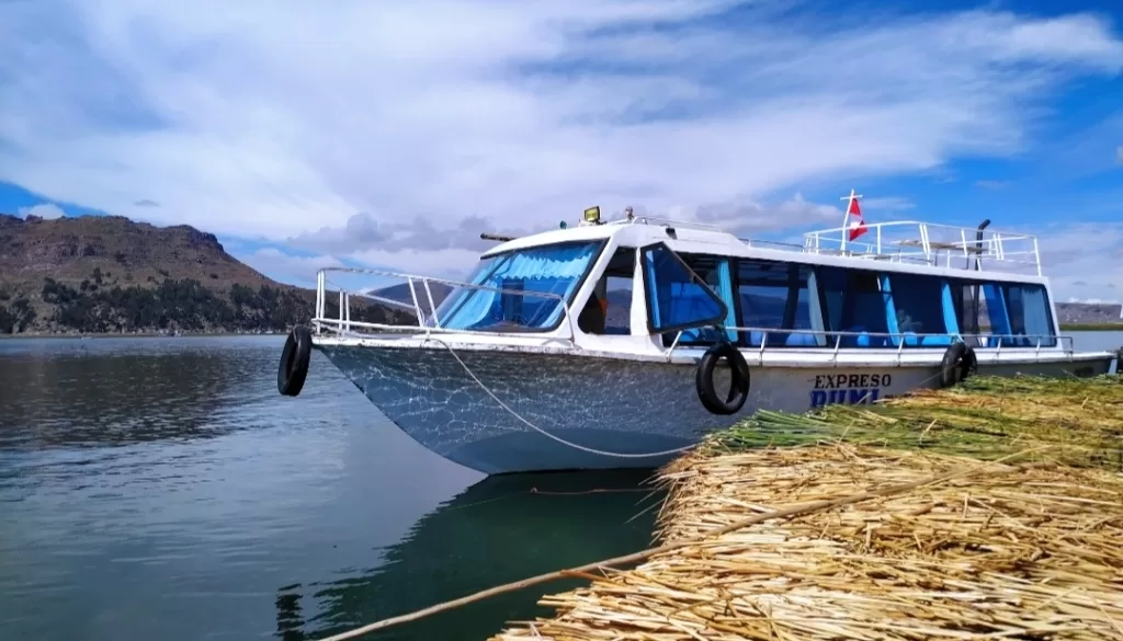 Covered section motor boat on Lake Titicaca