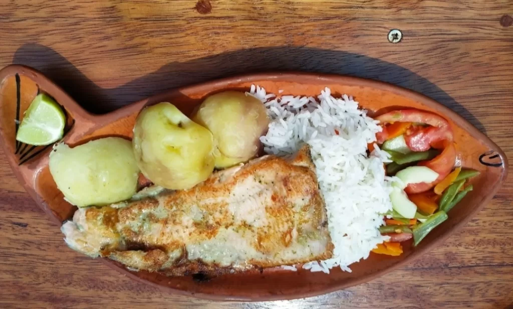 Grilled trout and rice for Lunch in Taquile
