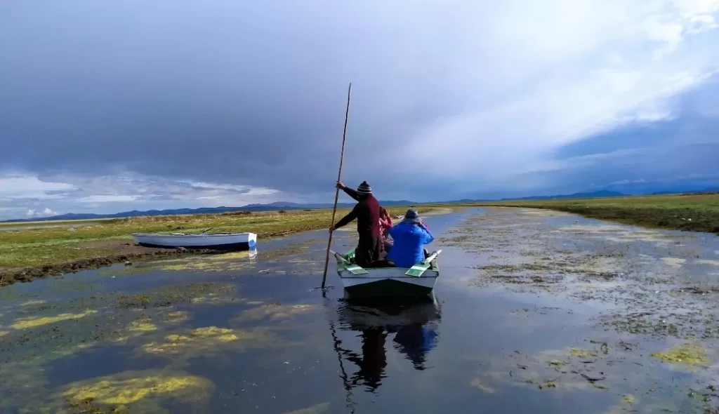 Rowing a wooden boat on Lake Titicaca