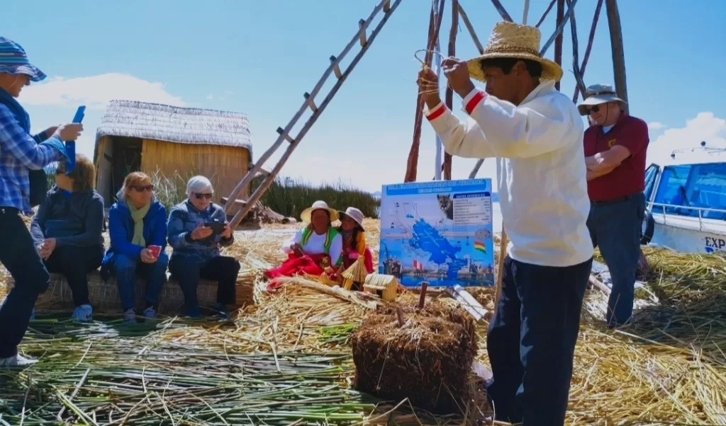 Local man explaining about the reed islands building