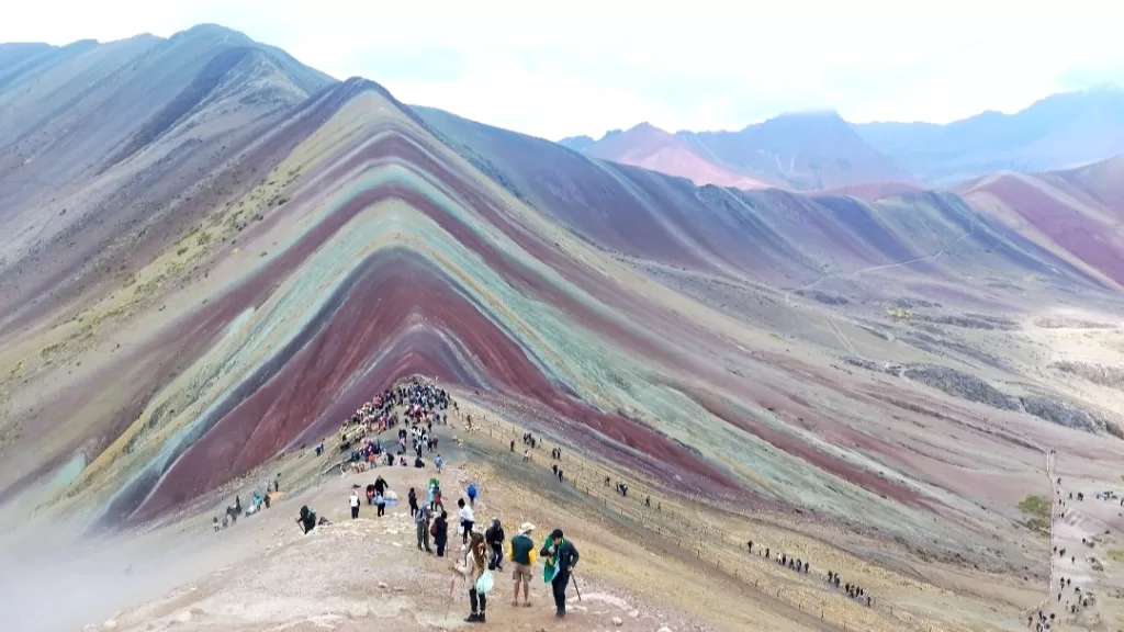 Conquering the peak of Rainbow Mountain in Cusco