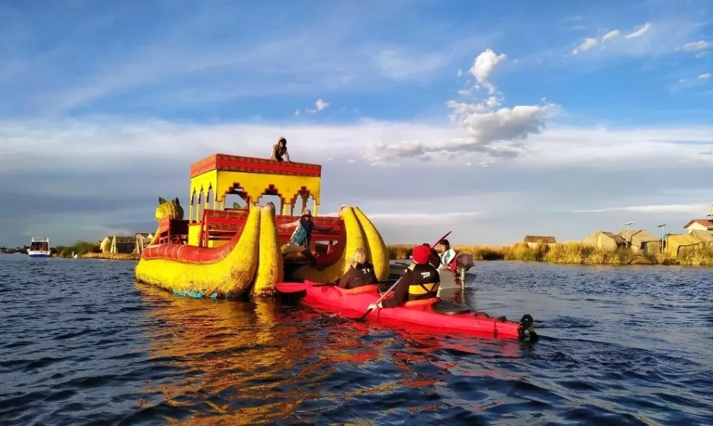 Kayaking behind the reed boat at Uros