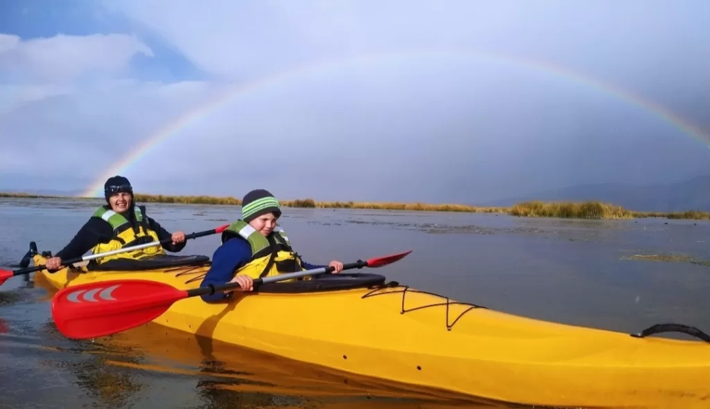 Kayaking under the rainbow in Lake Titicaca