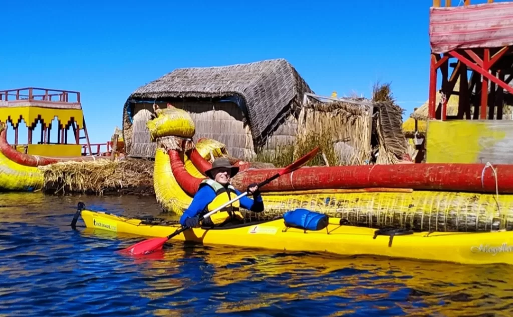 Paddling next to the Uros reed boat