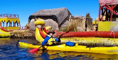 Paddling next to the Uros reed boat